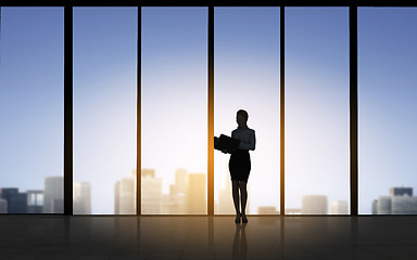 Image showing silhouette of business woman with folders