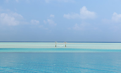 Image showing hammock in water on maldives beach