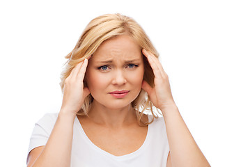 Image showing unhappy woman suffering from headache