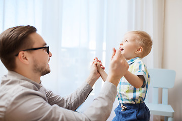 Image showing father with son playing and having fun at home