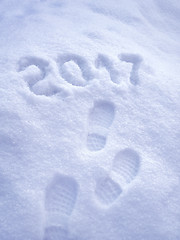 Image showing 2017 New Year greeting card, 2017 new year, foot step prints in snow, happy new year 2017 concept