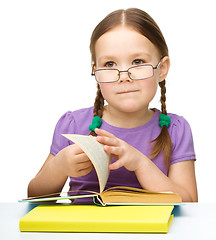 Image showing Little girl with books