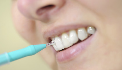 Image showing woman cleaning her teeth 