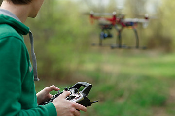 Image showing Man controling a drone.