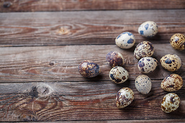 Image showing Group of quail eggs on thewooden background