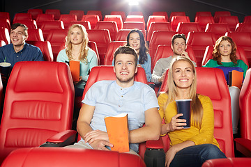 Image showing happy friends watching movie in theater