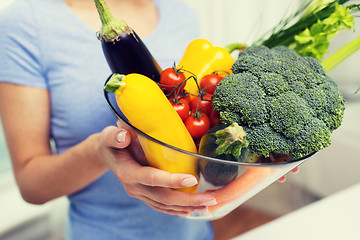 Image showing close up of woman holding vegetables in bowl