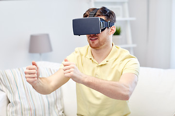 Image showing young man in virtual reality headset at home
