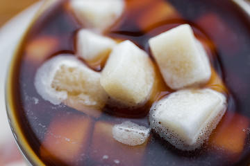 Image showing close up of lump sugar in coffee cup or tea