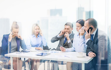 Image showing business team with smartphones having conversation