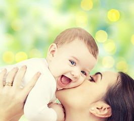 Image showing happy mother with baby over green background