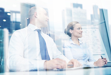 Image showing smiling business people meeting in office