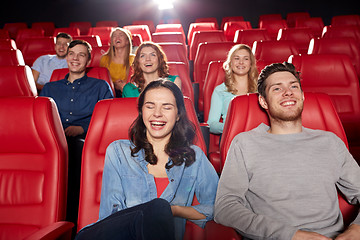 Image showing happy friends watching movie in theater