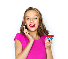 Image showing happy woman or teen girl with birthday cupcake