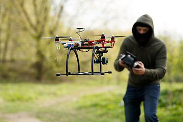 Image showing Man flying with the drone