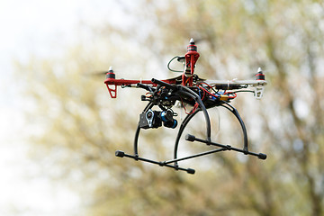 Image showing Quadrocopter while flying in the forest. 