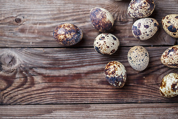 Image showing Group of quail eggs on thewooden background