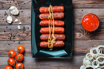 Image showing Sausage roasted on the grill.