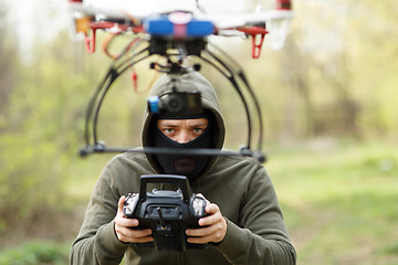 Image showing Man flying with the drone