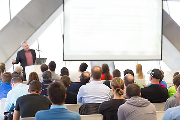 Image showing Male speeker having talk at public event.