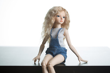 Image showing doll on a background of a brick wall.