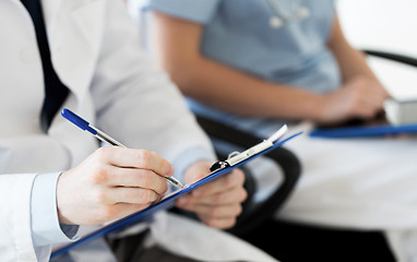 Image showing close up of happy doctors at seminar or hospital