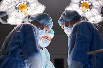 Image showing group of surgeons in operating room at hospital