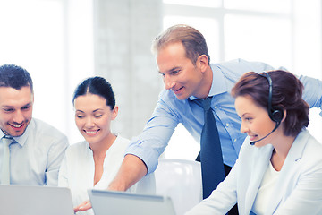 Image showing group of people working in call center