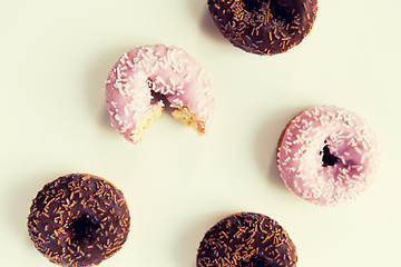 Image showing close up of glazed donuts pile over white