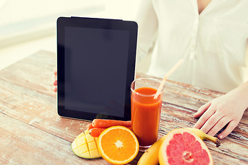 Image showing close up of woman hands with juice and fruits