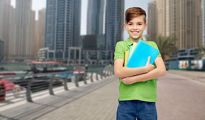 Image showing happy student boy with folders and notebooks