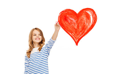 Image showing girl drawing big red heart in the air