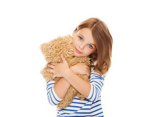 Image showing cute little girl hugging teddy bear