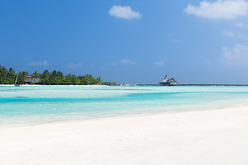 Image showing maldives island beach with palm tree and villa