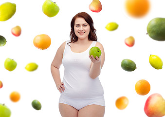 Image showing happy plus size woman in underwear with apple