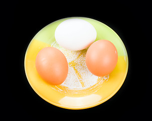 Image showing eggs on a plate on black background