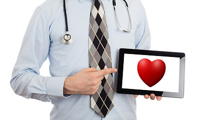 Image showing Doctor holding tablet - Red heart