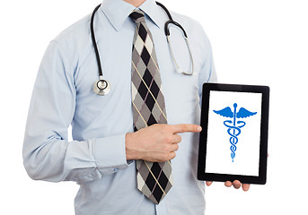 Image showing Doctor holding tablet - Caduceus symbol