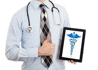 Image showing Doctor holding tablet - Caduceus symbol