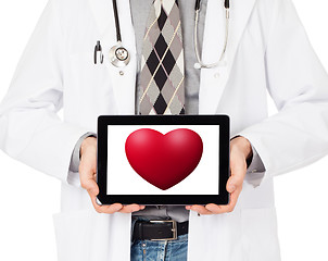 Image showing Doctor holding tablet - Red heart