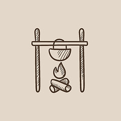 Image showing Cooking in cauldron on campfire sketch icon.