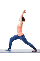 Image showing Woman practices yoga asana utthita Virabhadras