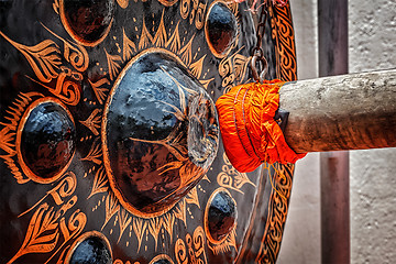 Image showing Mallet beating gong in Buddhist temple 