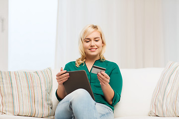 Image showing happy woman with tablet pc and credit card