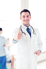 Image showing doctor with stethoscope showing thumbs up