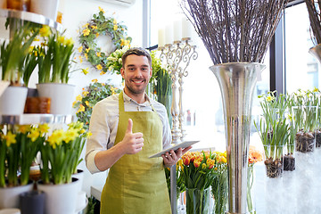 Image showing man with tablet pc computer at flower shop