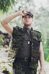 Image showing young soldier or ranger in forest