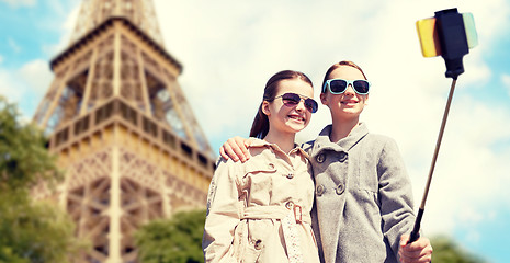 Image showing girls with smartphone selfie stick at eiffel tower