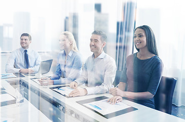 Image showing smiling business people meeting in office