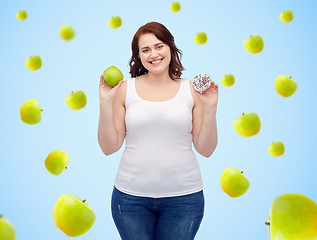 Image showing happy plus size woman choosing apple or donut